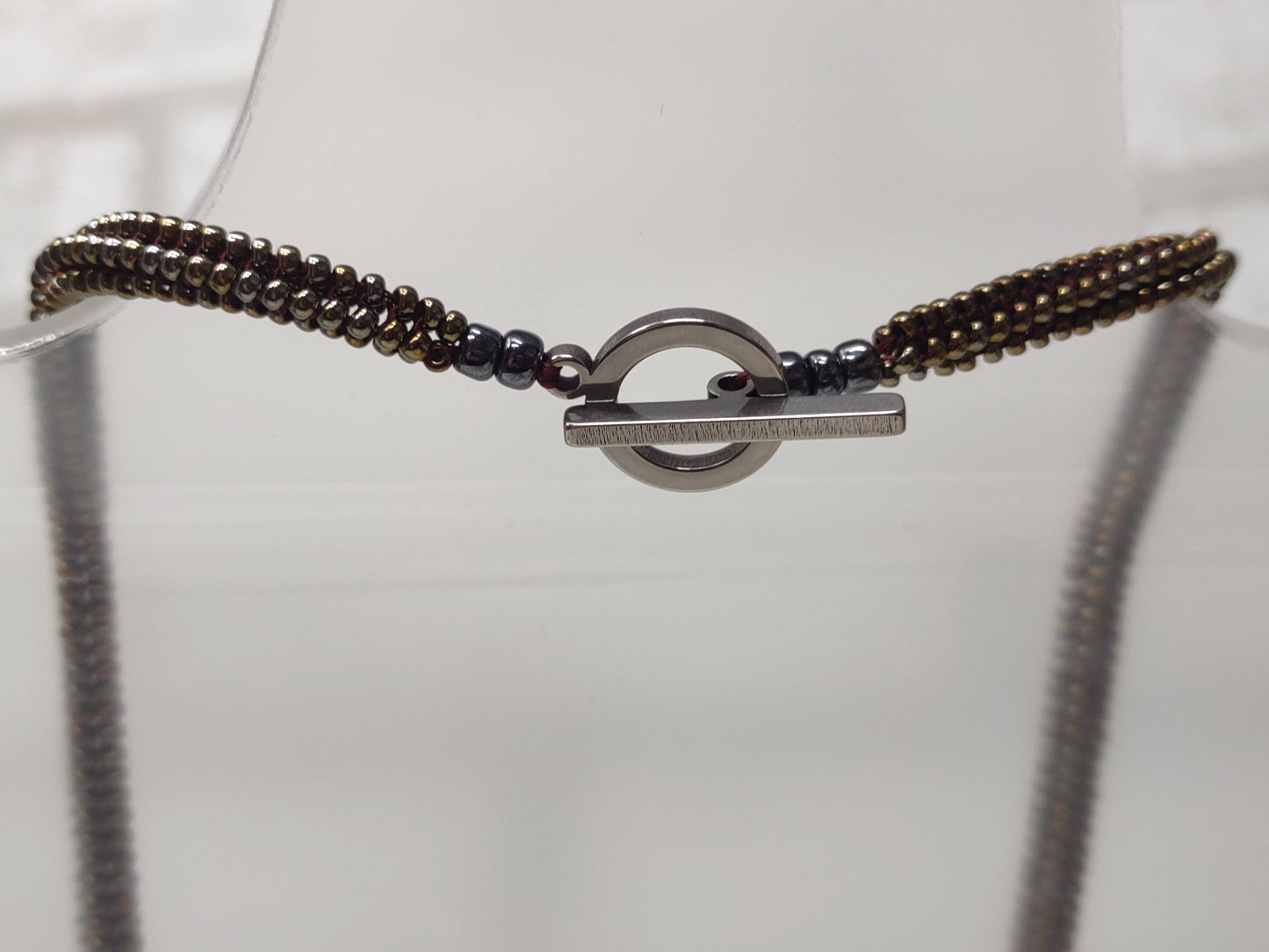 Metallic Bronze beaded Herringbone Necklace with Toggle clasp - close up of the stainless steel toggle clasp