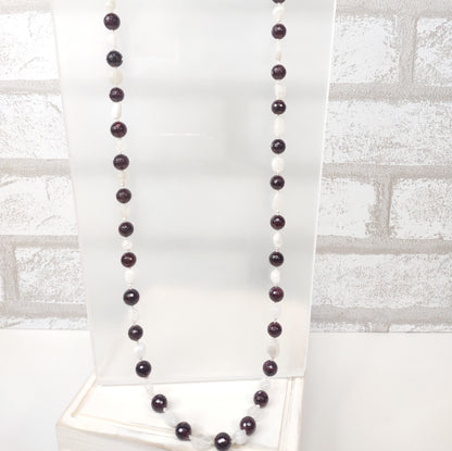 Hand-knotted Faceted Garnet Beads with smaller moonstone nuggets on silk cording.